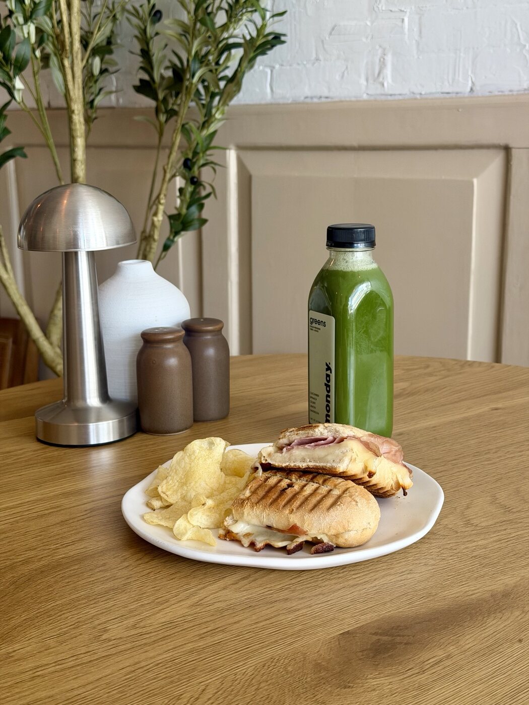 Toasted ham and cheese sandwich with green juice at CALA